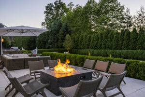 Patio with fire feature by Yerardi Landscaping